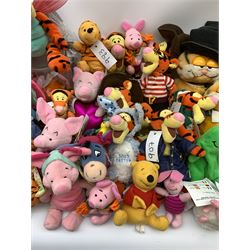 Over forty Walt Disney character soft toys including Tigger Pirate, Xmas Tree, Cowboy, Butterfly, Easter Rabbit etc, Eeyore Santa, Butterfly, Pirate etc, Piglet Lovebug, Valentine, Snowball etc; together with seventeen Garfield the Cat soft toys in various character costume including Skier, Graduate, Aviator, car rear window stickers etc