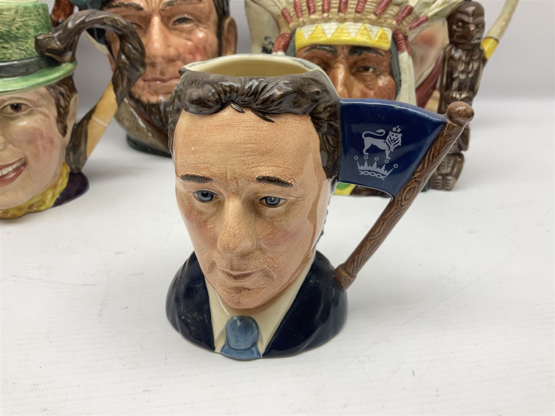 Collection of Royal Doulton and Beswick character jugs of various sizes, including North American Indian D6611, The Falconer D6533,  Tony Weller 281, Sairey Gamp 371 etc