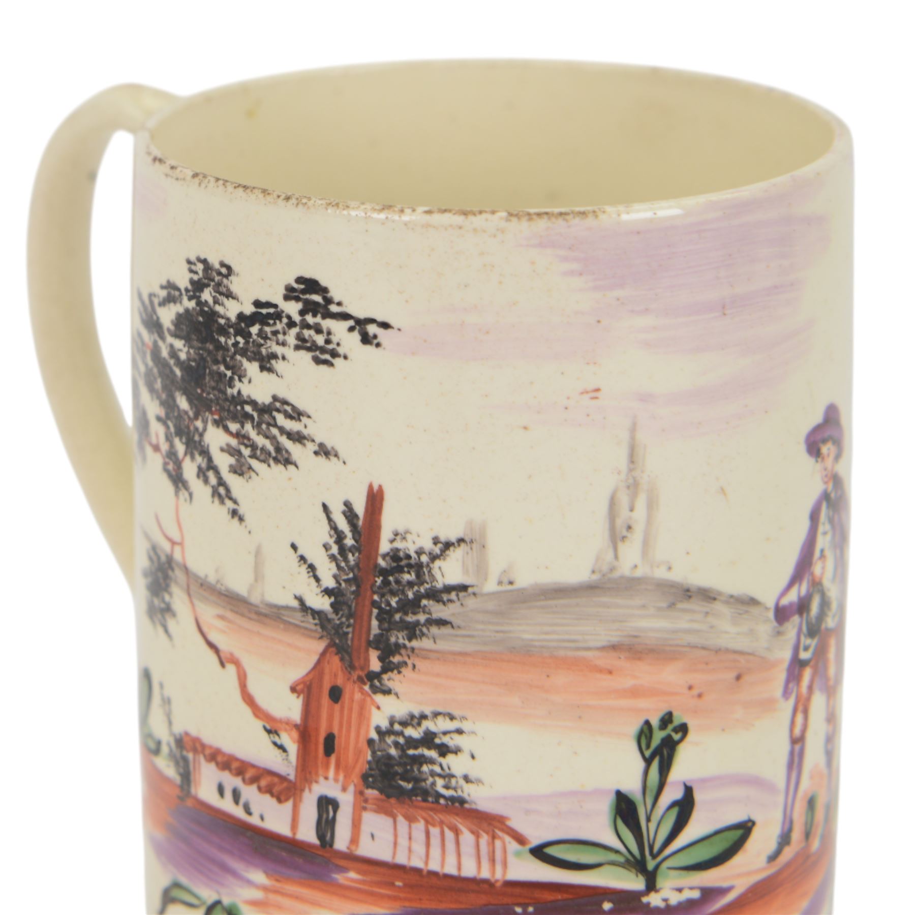 18th century Leeds creamware mug, circa 1770, of cylindrical form with curved strap handle, painted in purple, red and green with a peasant toasting with a glass of ale within a bucolic setting, H12.5cm