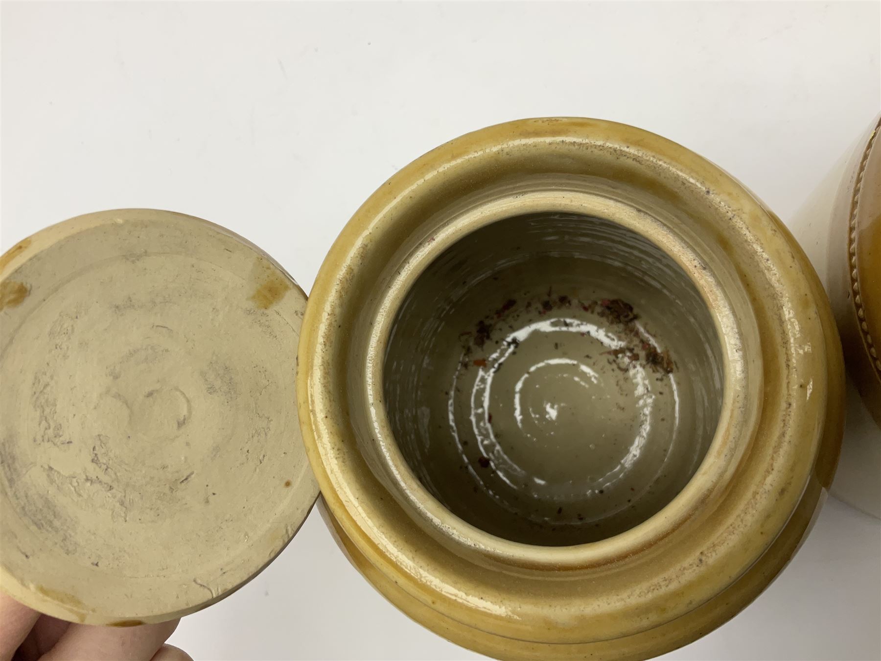 Large 2 gallon stoneware flagon, stamped 'John Soulby Wine Merchant Malton 2 Gall', together with a collection of similar stoneware jars and bottles, largest H40.5cm