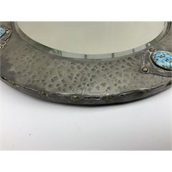 Arts & Crafts style circular hammered pewter mirror inset with four turquoise cabochons, D27.5cm