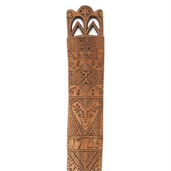 Treen carved a stay busk, dated 1756, the decorated with geometric boarded and foliate sprigs, with pierced top finished with three stars, H37cm