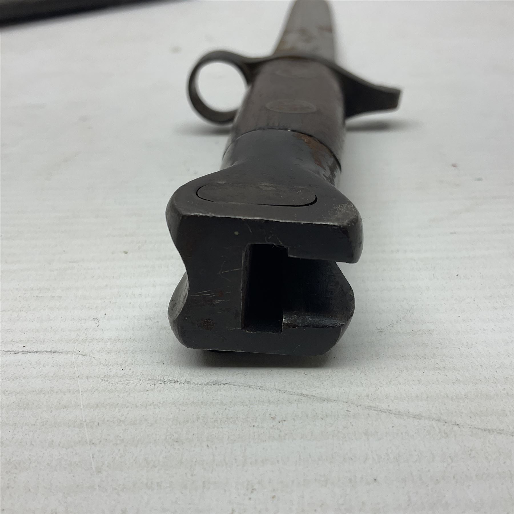 British Pattern 1888 knife bayonet, the 30.5cm double edged blade with raised central medial ridge; in leather covered scabbard L40.5cm overall