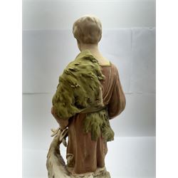 Pair of Royal Dux figures, no. 1115, modelled as a shepherd with a goat by his side and a shepherdess feeding a lamb, each wearing flowing green and pink robes with gilt detailing, with pink triangle mark beneath, H51cm