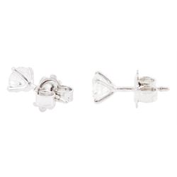 Pair of 18ct white gold diamond earrings, each stud set with a round brilliant cut diamond, in a four claw setting, stamped 750, total diamond weight approx 1.10 carat