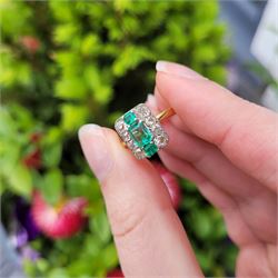 Early 20th century gold emerald and diamond panel ring, three octagonal cut emeralds, with four old cut diamonds set either side, stamped 18ct Plat, total diamond weight approx 0.85 carat