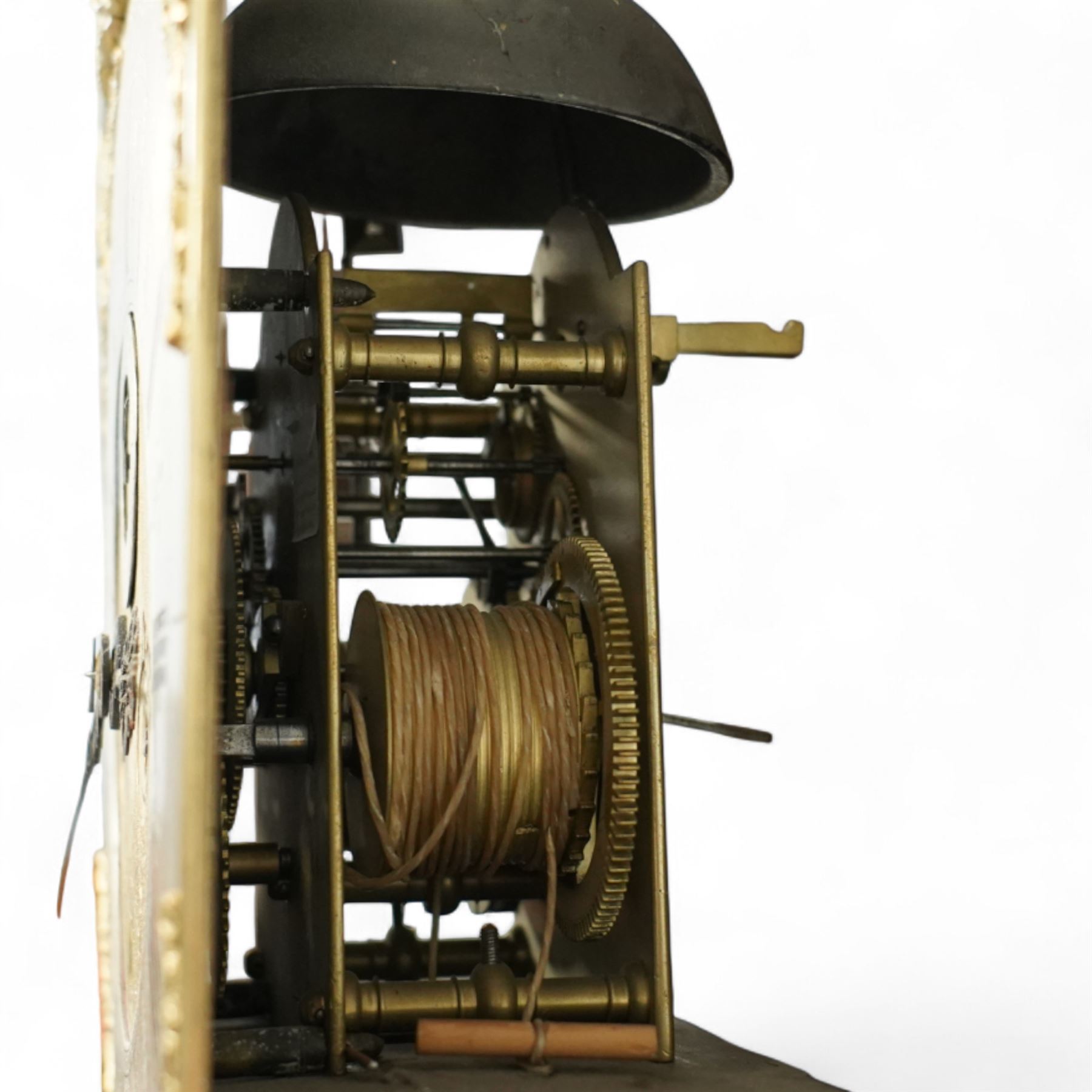 Man Beckett (I) of Stockton on Tees (Co Durham) - 8-day early 18th  century longcase clock in a  profusely carved oak case, with a caddy top, turned finials and attached barley twist pilasters to the break arch hood door, long trunk with carving and a conforming long rectangular door carved with a Celtic depiction of the tree of life, corresponding plinth with a carved and decorative base, break arch brass dial with a rounded brass surround, cast spandrels and silvered boss with the makers name to the arch, matted dial centre with seconds dial, ringed winding apertures, square date aperture and fettled steel hands, silvered chapter with Roman numerals, five minute Arabic's, half hour markers, minute and inner quarter hour tracks, dial pinned to a five pillar movement with inside countwheel striking and a recoil anchor escapement, striking the hours on a bell. With weights and pendulum.
Man Beckett (I), (first name is a biblical name short for Manasseh), was the first member of the Beckett family of prodigious clockmakers working in the North-East of England from 1720 until 1884.