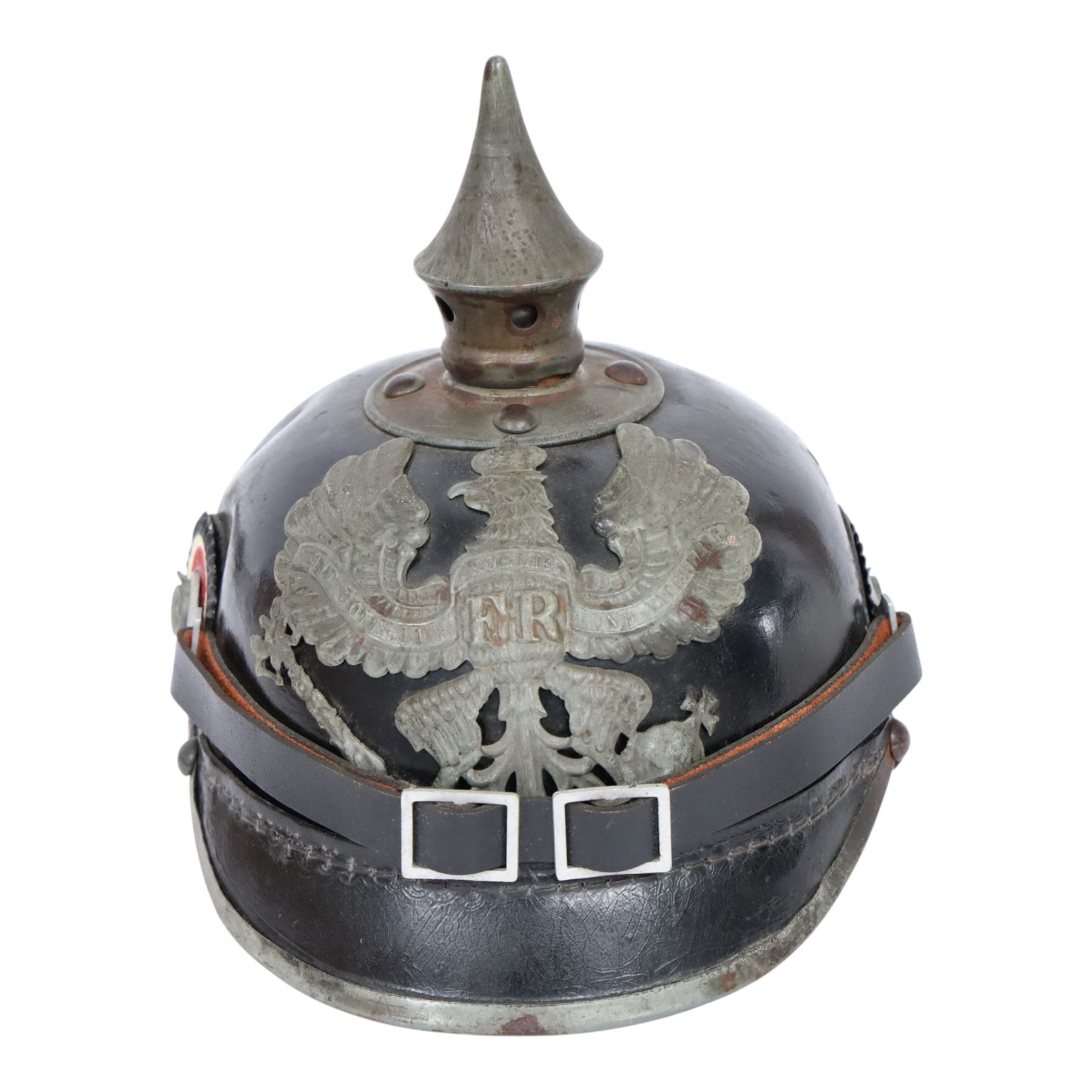 WWI Prussian M1915 Pickelhaube, the black leather skull with removable steel spike finial, steel eagle helmet plate and leather chin strap, one side with a black cockade, the other black and red