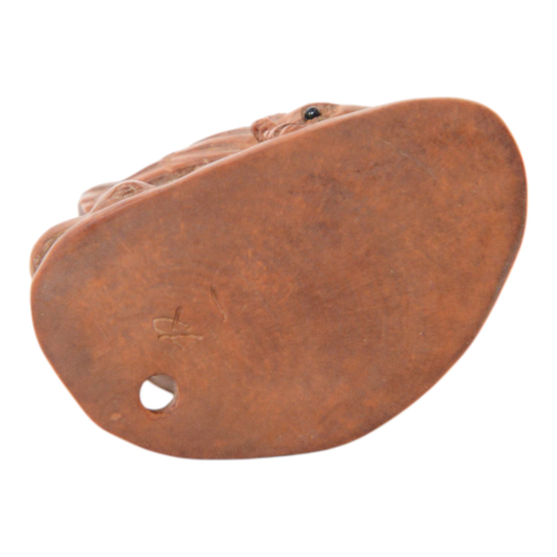  Two wooden netsuke, in the forms of a foo dog and a chicken, both signed to the base, H6cm