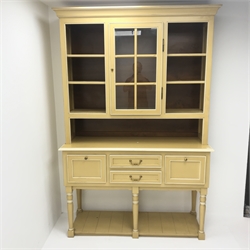 Painted dresser, projecting cornice two display doors above  two central drawers flanking two cupboards, turned supports joined by undertier, W144cm, H215cm, D50cm
