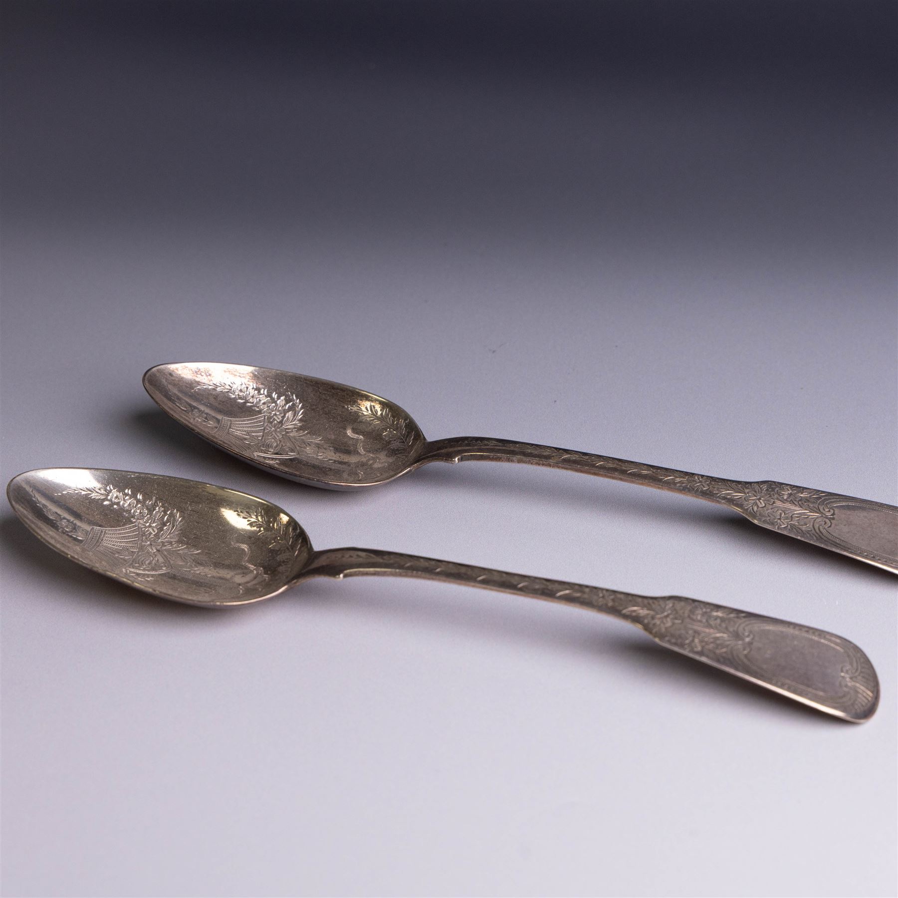 Pair of George III silver Fiddle pattern table spoons, each with bright cut floral and foliate decoration, hallmarked Sarah & John William Blake, London 1815