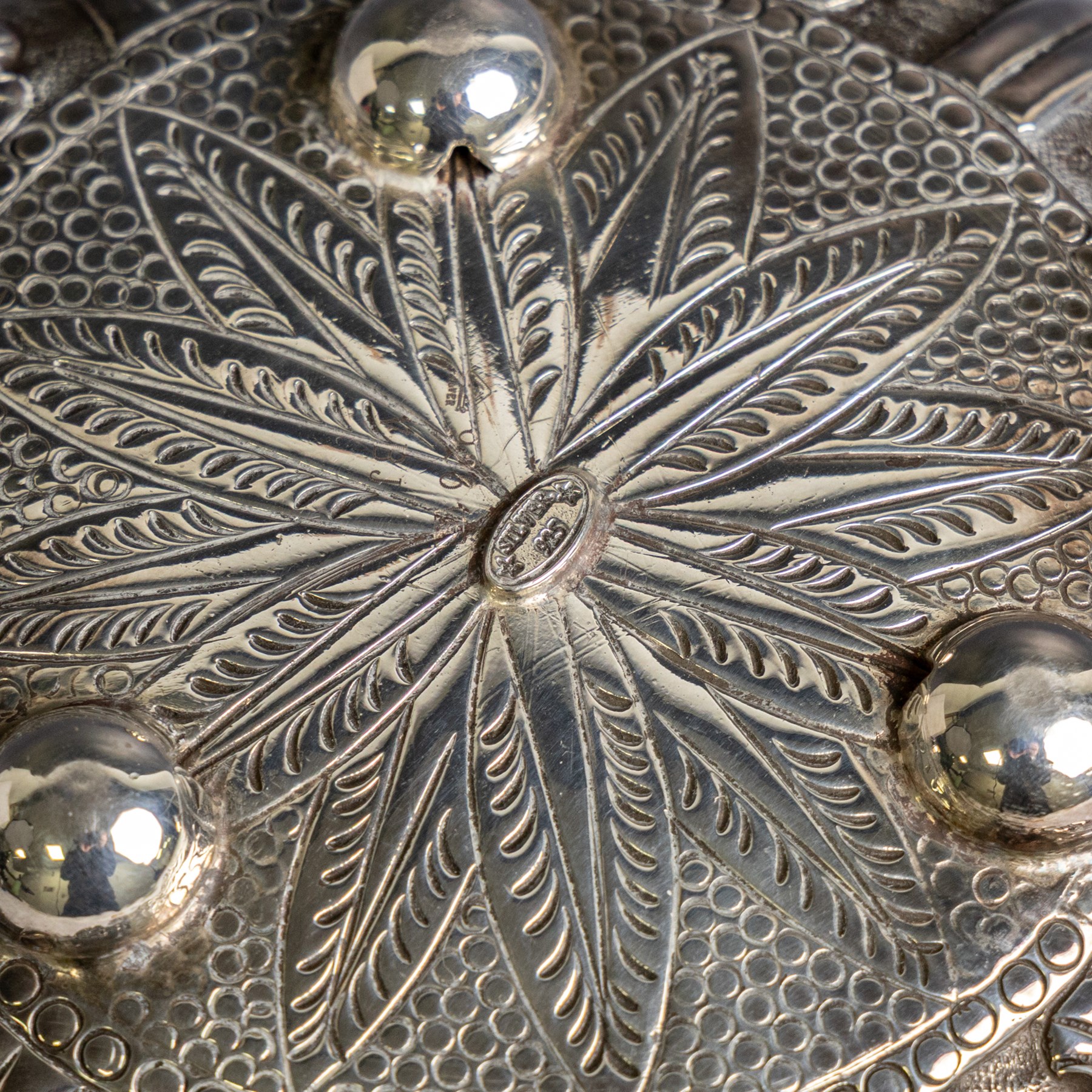Indian silver bowl, of circular form with embossed acanthus leaf decoration, upon three bun feet, D5.5cm, H13cm