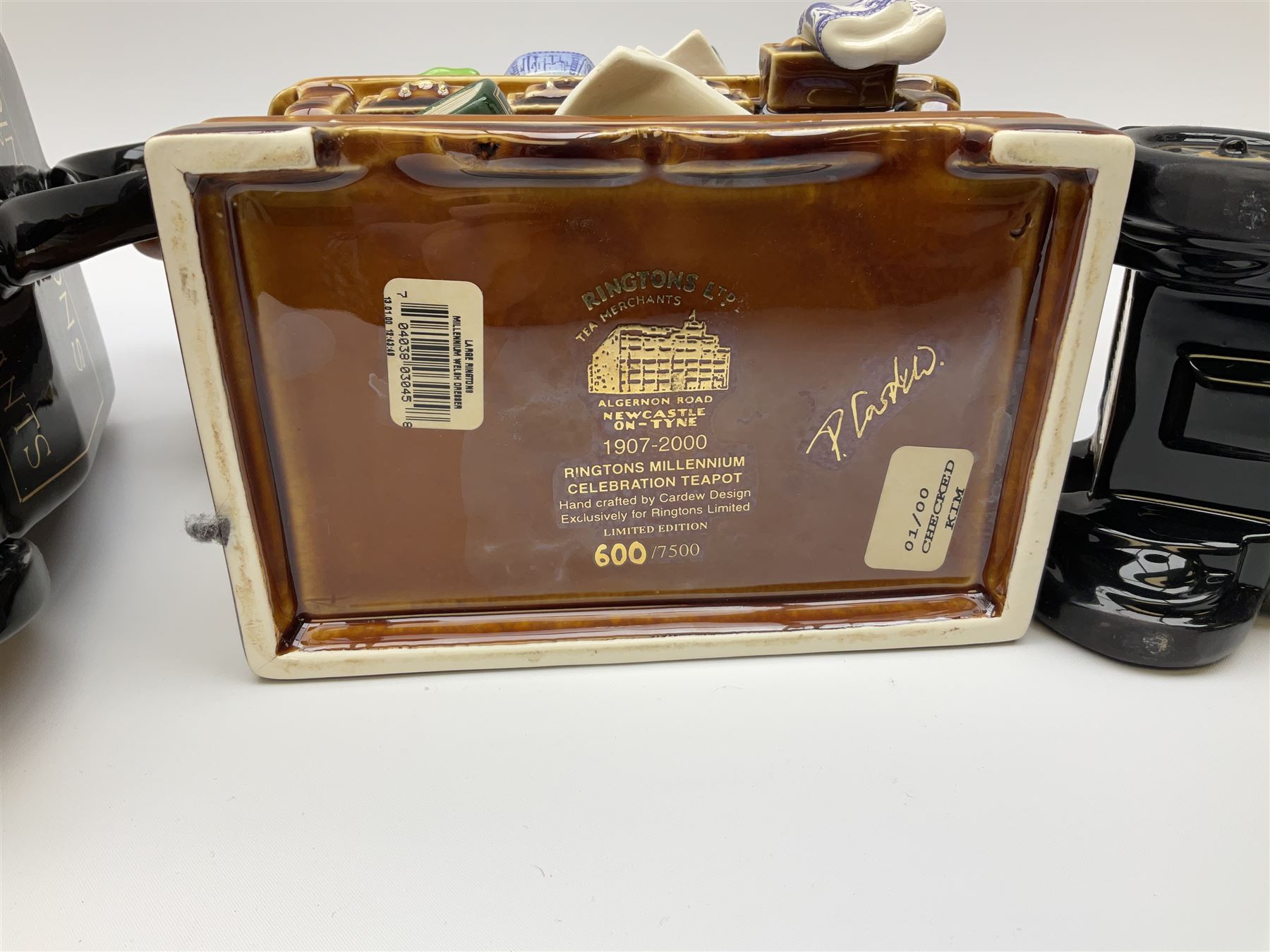 Three Ringtons novelty teapots, comprising The Ringtons Van teapot, the Tea Merchant teapot, and Millenium Celebration teapot. 