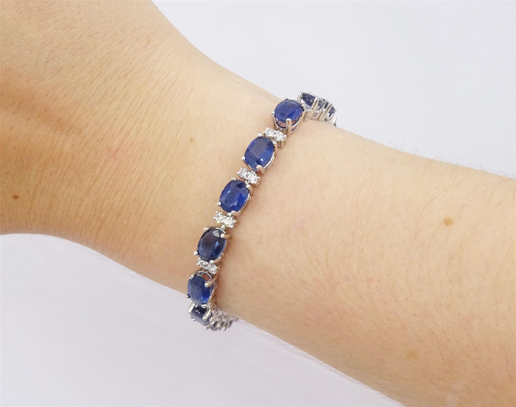 18ct white gold oval cut sapphire and round brilliant cut diamond bracelet, total sapphire weight approx 19.50 carat