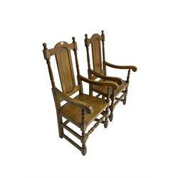 Pair William and Mary design oak armchairs, high back with turned uprights flanking central panel, scrolled arm terminals raised on turned supports united by stretchers