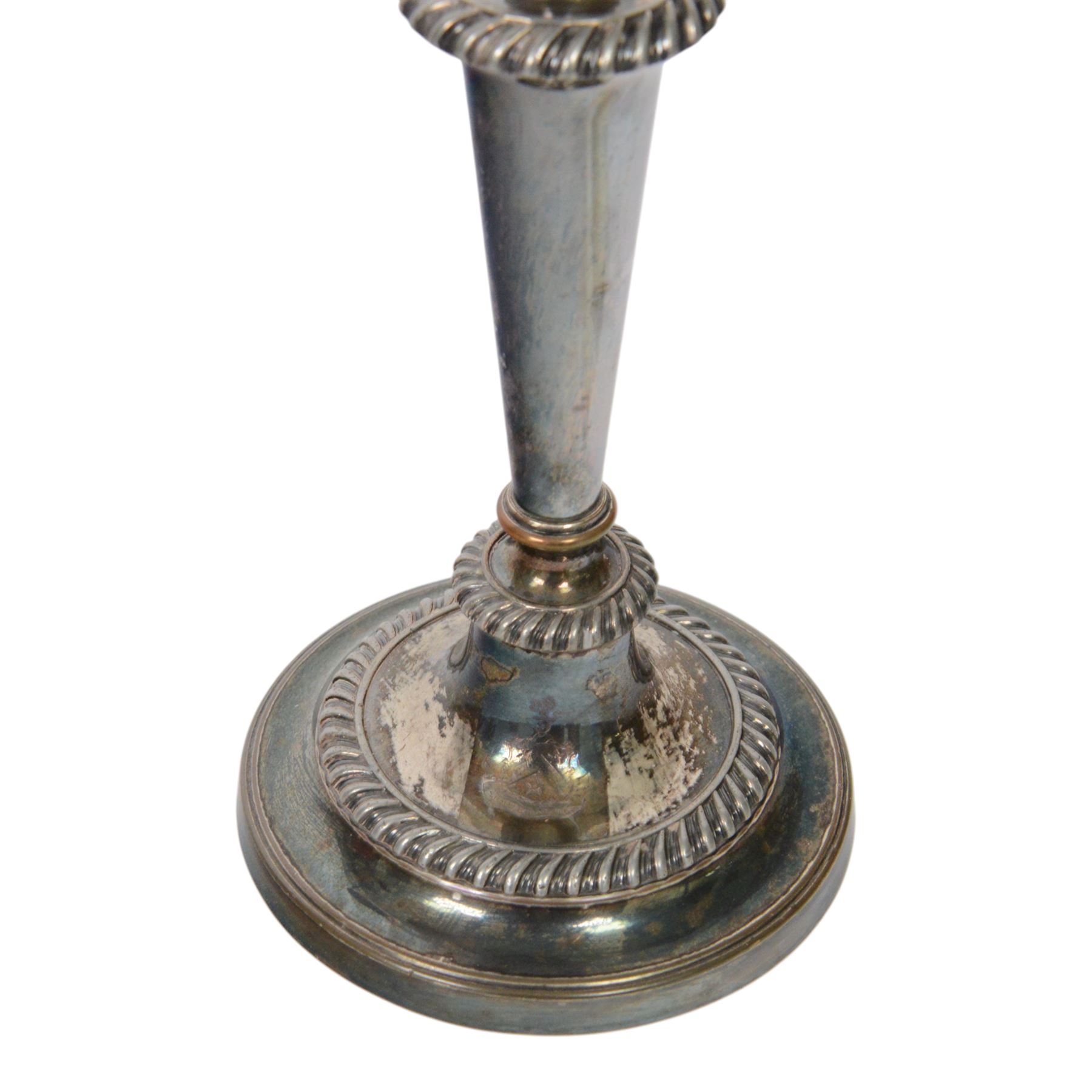 Pair of silver plated three branch candelabra, each with three urn-shaped sconces, with scroll arms, tapering stem upon a circular base, together with silver plated wine flagon