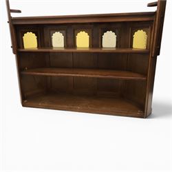 Old Charm - carved oak bar with three bar stools and associated Old Charm drinks cabinet, carved top with channels for glassware beneath, bar surface above glazed panels, shelves for glassware to the back, associated Old Charm drinks cabinet with fall front linenfold carving, above twin doors with shelved interior