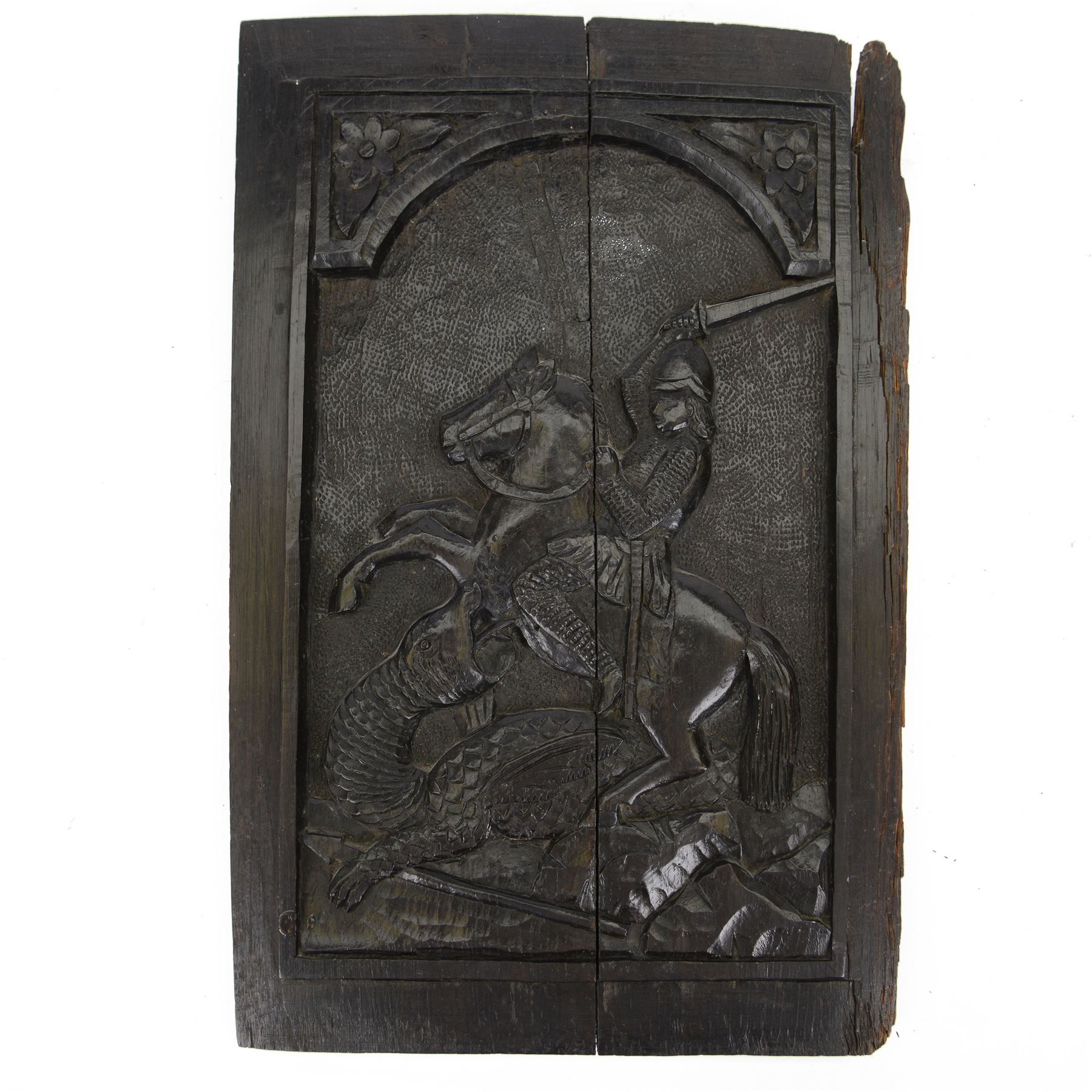 18th century carved oak panel depicting St George slaying the dragon, H38cm