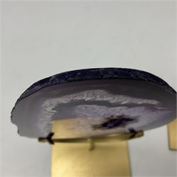 Pair of purple agate slices, polished with rough edges raised upon gilt metal stands
