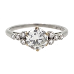 Platinum single stone diamond ring, with four diamonds set either side, stamped PLAT, central diamond approx 0.80 carat