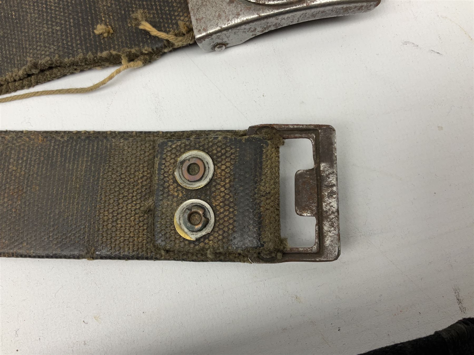 WW2 German Hitler Youth belt, the buckle marked 'Blut Und Ehre' and impressed RZM M/4/55 verso; and another Hitler Youth belt with similarly marked buckle (2)