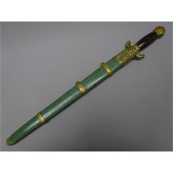 Chinese double sword Qing Dynasty each with 42cm diamond section steel blade, cast brass mounts and horn grip in shagreen covered scabbard with ornate brass mounts 63cm overall  