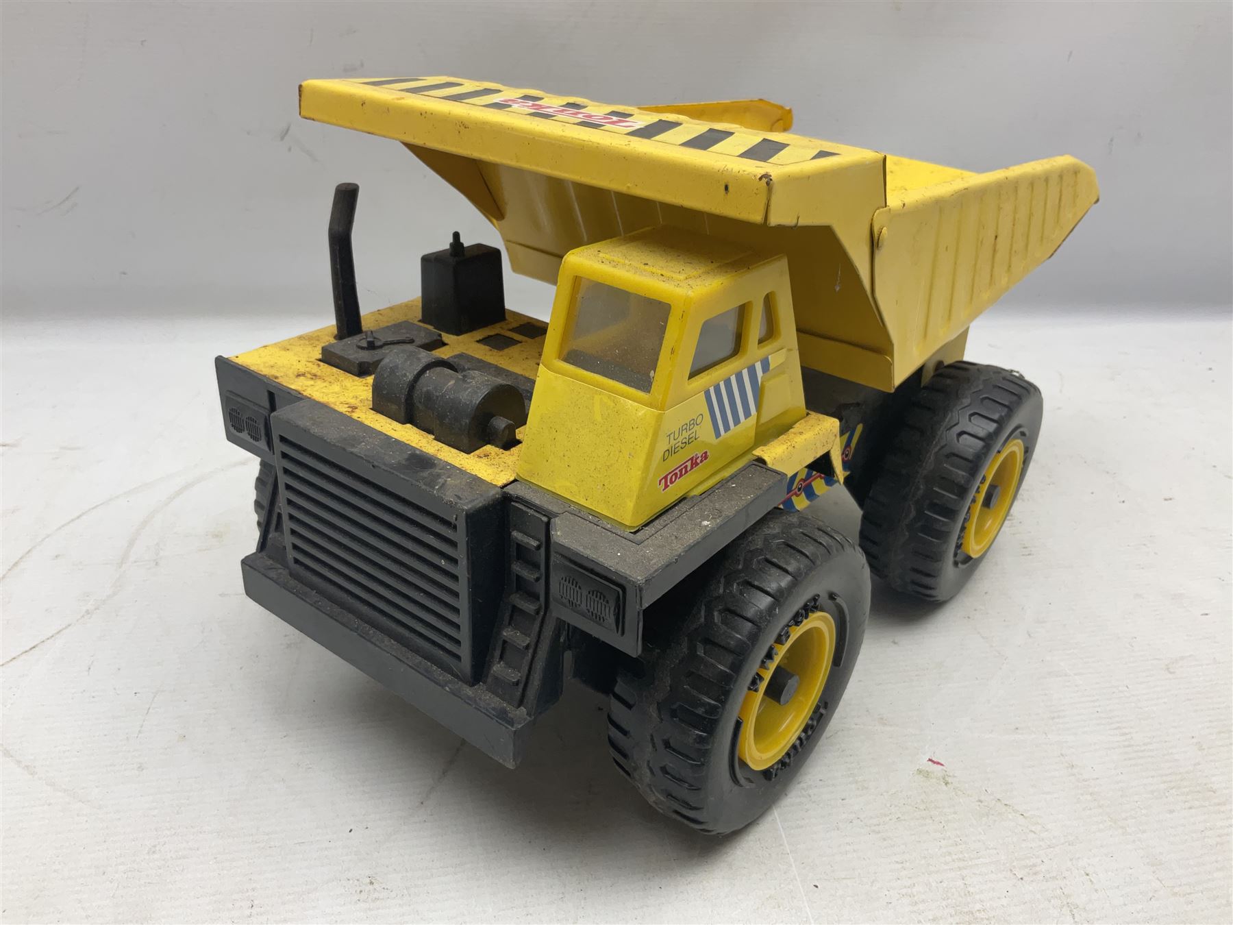 Tonka - five large scale pressed steel vehicles comprising Cement Mixer, Mobile Crane, Bulldozer and two Dumper Trucks (5)