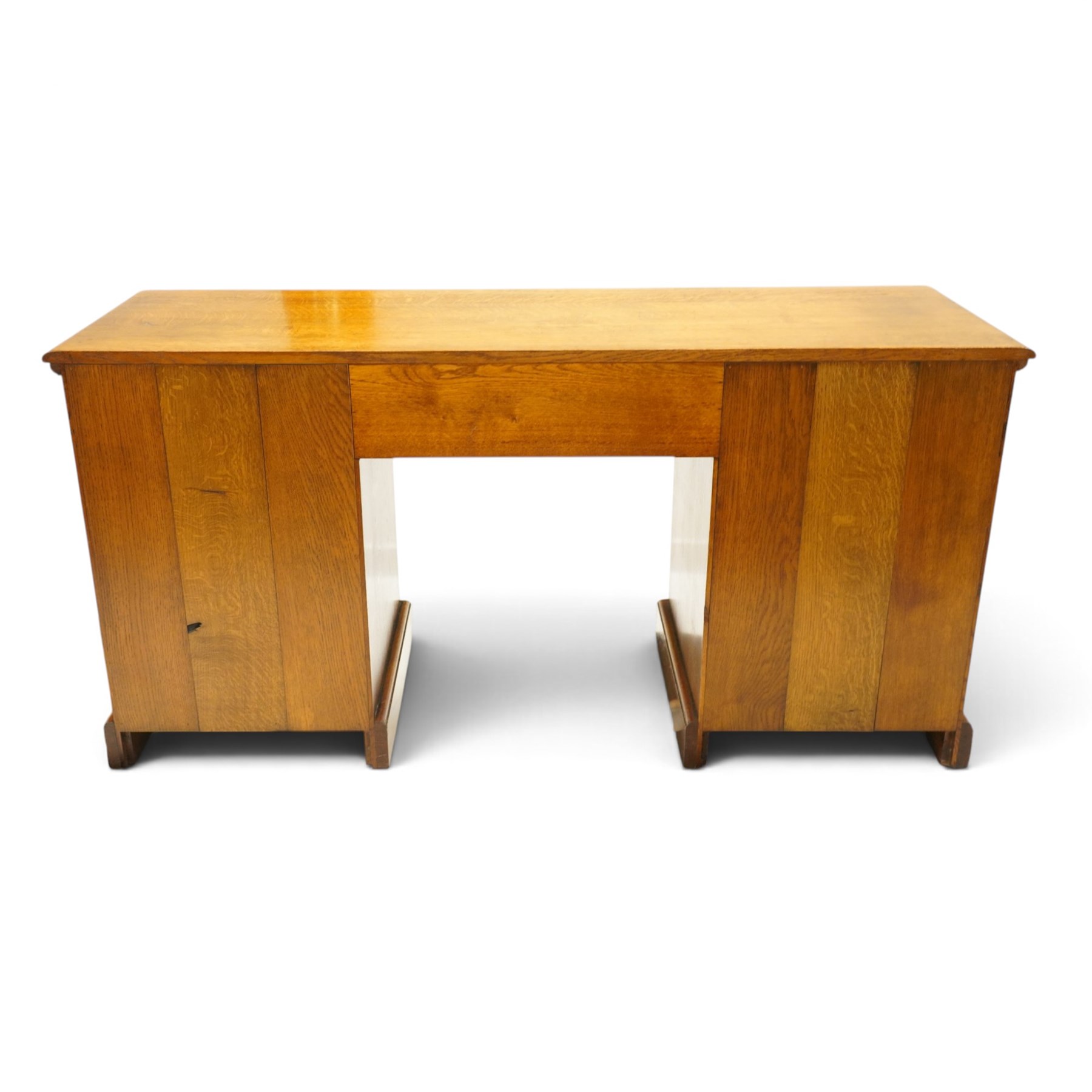 Royal Oak Furniture Company Of Grassington - Georgian design oak kneehole desk, rectangular top with moulded edge, fitted with central frieze drawer flanked by eight graduating drawers, raised on skirted base