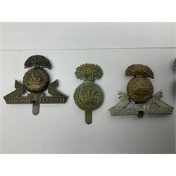 Nineteen Yeomanry metal cap badges including Derbyshire, Northamptonshire, Essex, Glamorgan, Staffordshire, City of London, Surrey, Shropshire, Hertfordshire etc; together with eleven Fusiliers badges including Lancashire, Royal Welch, Northumberland etc (30)