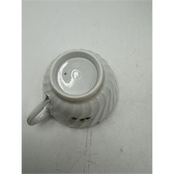 18th century Caughley blue and white sparrow jug, decorated in the Mother and Child pattern, circa 1780-1790, with underglaze C mark beneath, H9cm, together with a Worcester coffee cup, circa 1785 painted with floral sprays in underglaze blue and gilt, with crescent mark beneath, and a Caughley trio of tea cup, tea bowl and saucer, each of moulded wrythen fluted form and decorated with gilt and blue sprigs and bands, each with crescent mark beneath, (5)