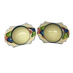 Four Clarice Cliff Bizarre grapefruit bowls, comprising two in orange chintz pattern and two with stylised flowers and foliage with blue banding, L17cm