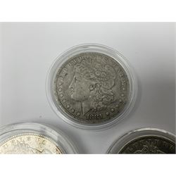 Three United States of America silver Morgan dollar coins dated 1881 O, 1882 and 1882 O