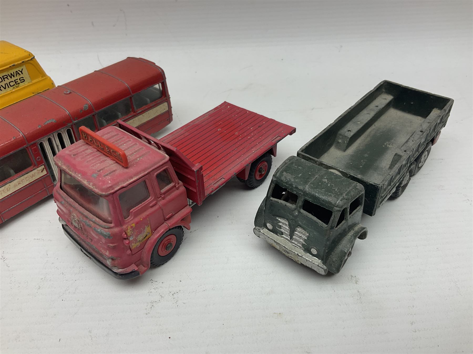 Dinky - sixteen unboxed and playworn die-cast models to include Single Deck Bus, two Atlantean Buses, Ford Transit Van, 10 Ton Army Truck, MGB Sports Car, Telephone Service Van etc 