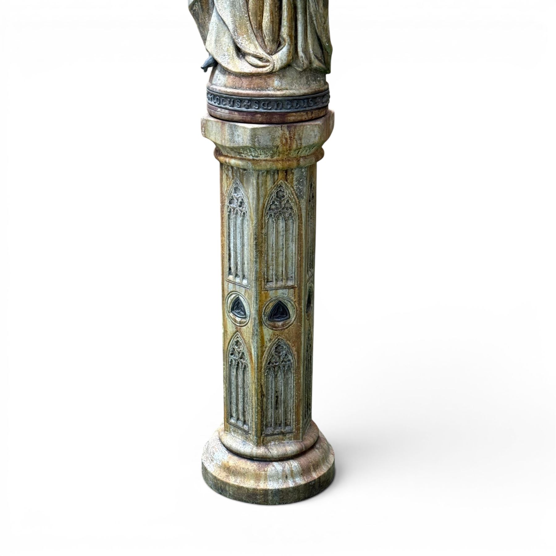Farran stone garden statue depicting a hooded monk standing in flowing robes in circular form, set upon Gothic pedestal with arched panels, featuring lead hands and script band