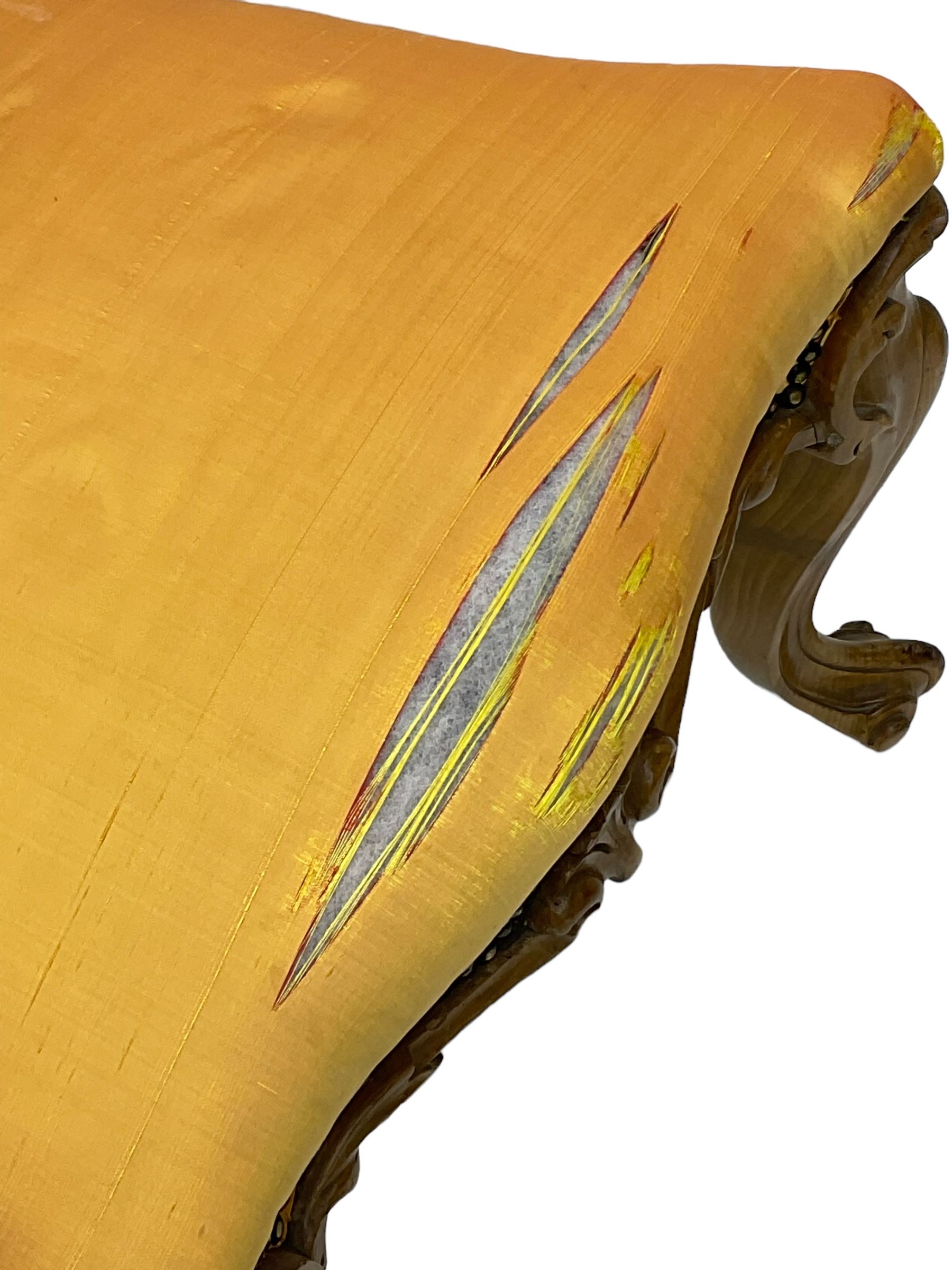 Pair of Victorian walnut side chairs, shaped cresting rail carved with acanthus leaves, overstuffed upholstered seats with stud band, on cabriole supports with scroll carved terminals