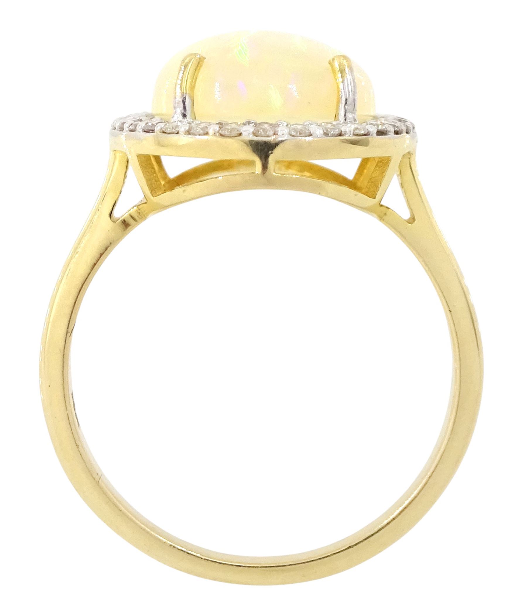 14ct gold opal and diamond cluster ring, single cabochon cut opal of approx 2.80 carat, with round brilliant cut diamond surround, stamped, total diamond weight approx 0.35 carat