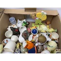 Large collection of egg cups, together with teacups, saucers and other collectables in four boxes 