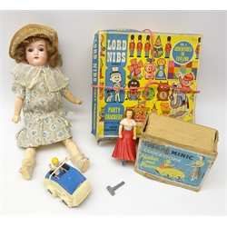  Early 20th Century German bisque head doll, Tri-ang minic clockwork mother and pram in original box with key and a 'Lord Nibs Series' set of party crackers  