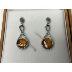 Two pairs of silver Baltic amber pendant earrings, both stamped 925 and boxed 
