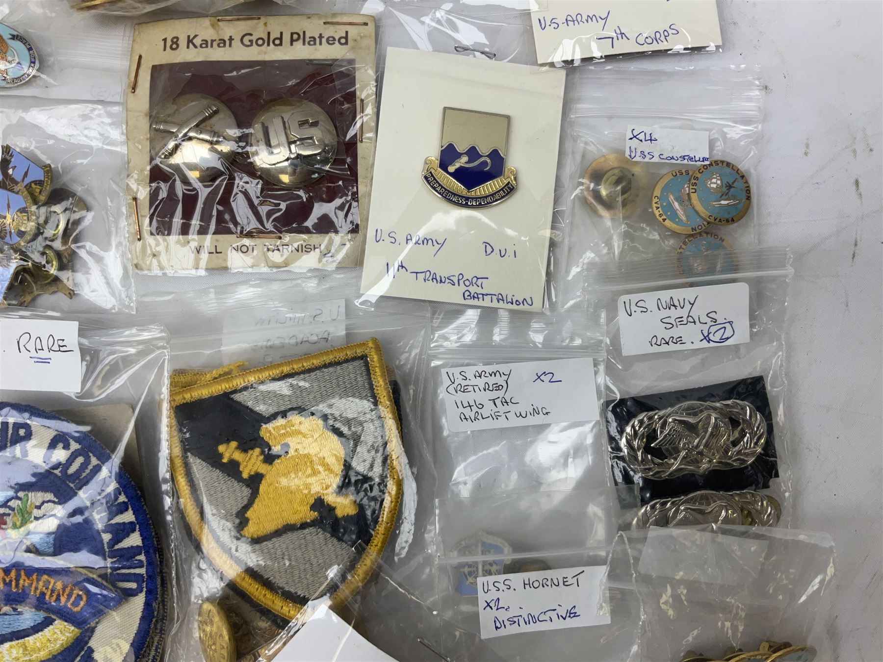 American patches and badges, including para wings, USS Constellation, Strategic Air Command, U.S. military academy, health service regt, Navy Seals, Air Defence Command, Seventh Fleet, various collar badges etc