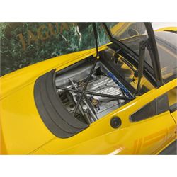 Two Maisto 1:12 scale Jaguar XJ220 ‘Racing’ cars in yellow, both on plinths in original boxes 