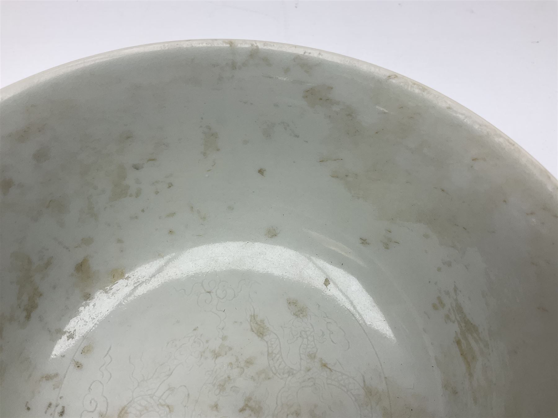 Pair of Chinese famille jaune bowls, decorated in green enamel with a dragon chasing a flaming pearl amongst clouds, upon a yellow ground, the interior decorated to centre with dragon, with six character mark beneath, D17.5cm