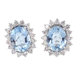  Pair of 18ct white gold aquamarine and diamond cluster stud earrings, hallmarked, aquamarine approx 5.3ct, diamonds approx 1.1 carat   