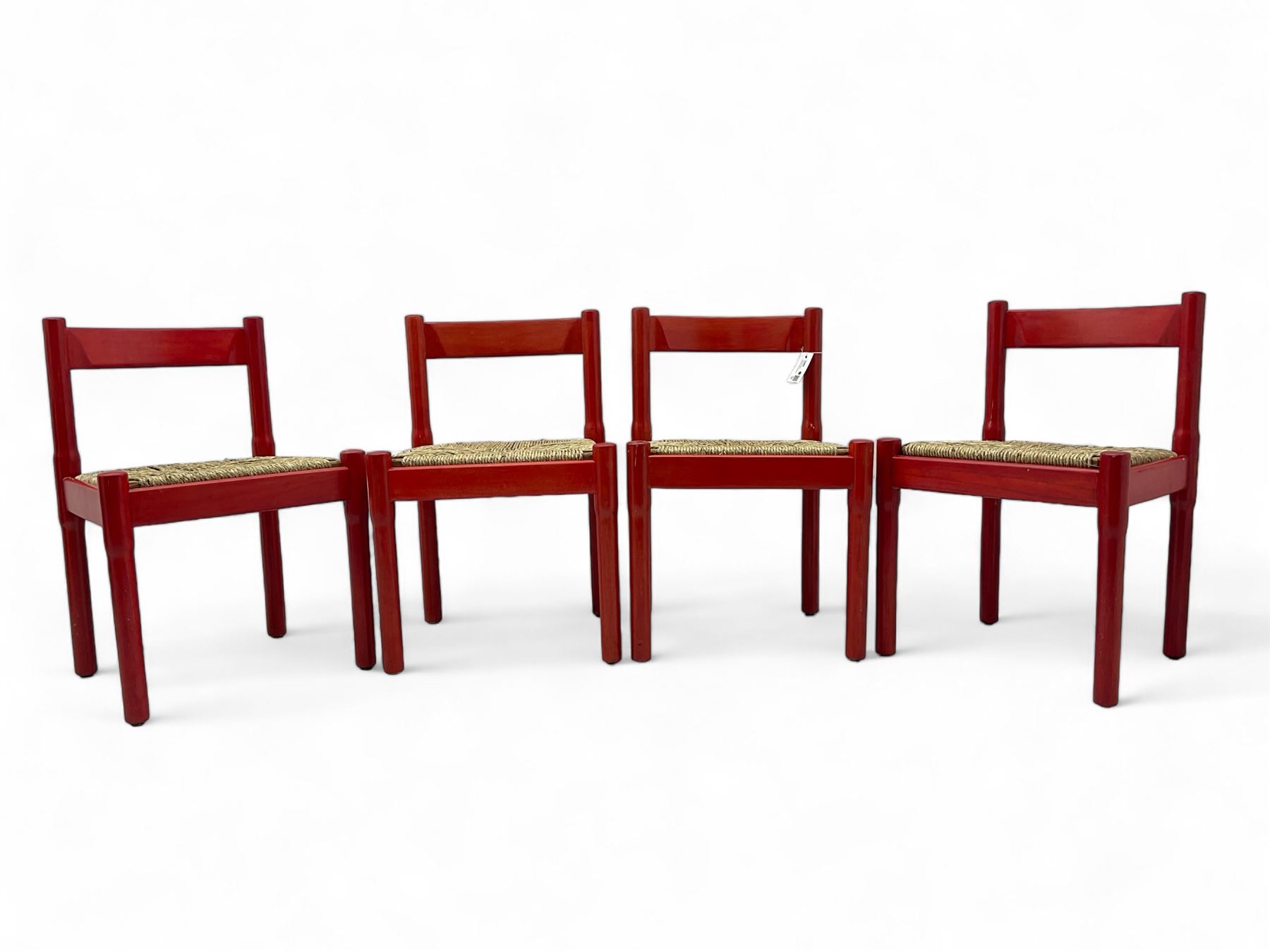 Vico Magistretti - mid-20th century circa. 1970s set of four beech framed dining chairs in red finish, with drop-in rush seats
