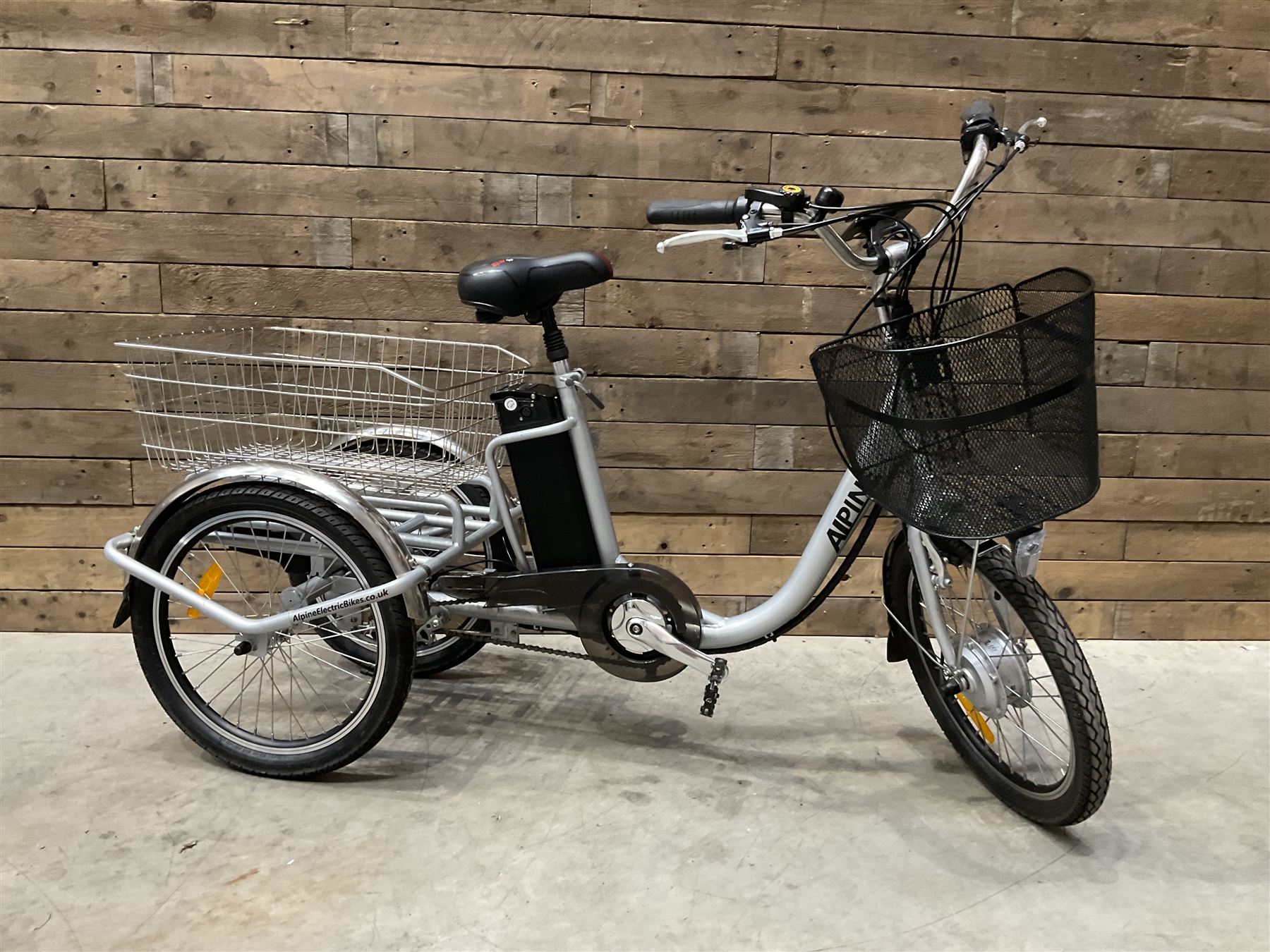 Alpine electric tilt trike - power assisted with throttle (no need to pedal), 15.5mph with 40 mile range, only 37 miles from new, silver finish, removable battery with charger, YoungDo gell seat with cover, £2749 new.
