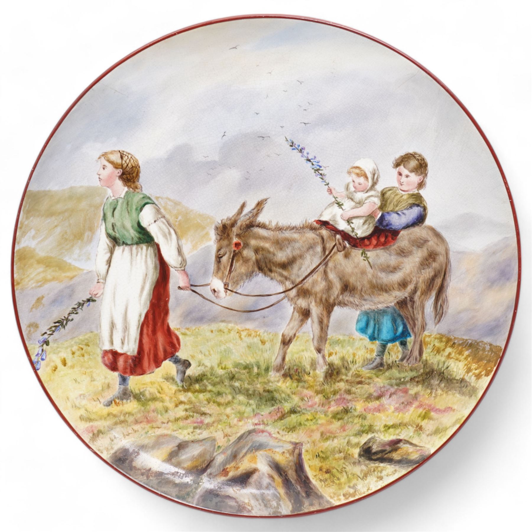 Victorian charger with hand painted decoration, depicting children leading a donkey, signed E L McMunn and dated 18*6 verso, D42cm