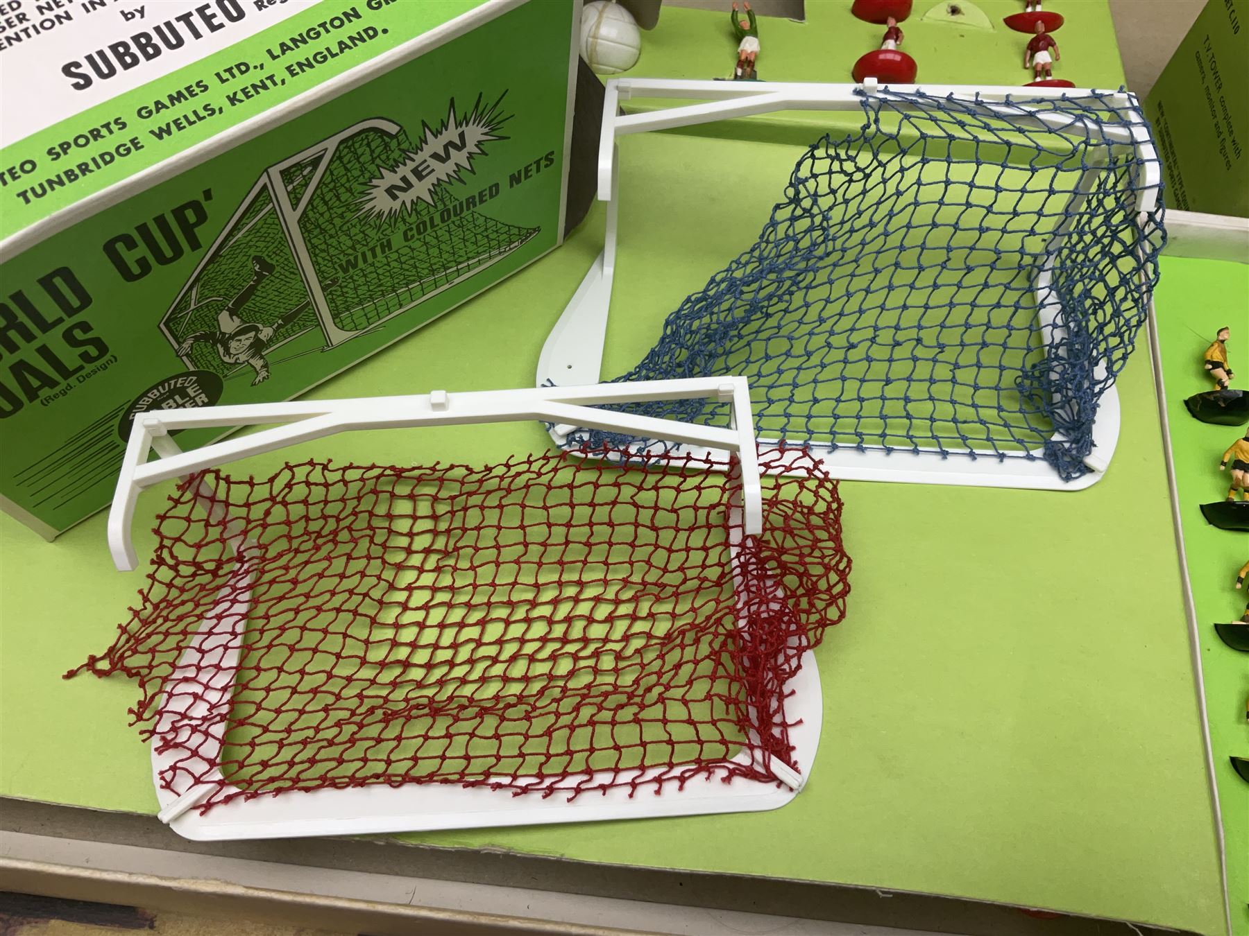 Subbuteo - three boxed sets comprising Football Express with two five-a-side teams and floodlighting; Continental with four teams and accessories; and International Edition Table Rugby with two teams; together with a Real Madrid 1974-75 League Champions pennant (4)