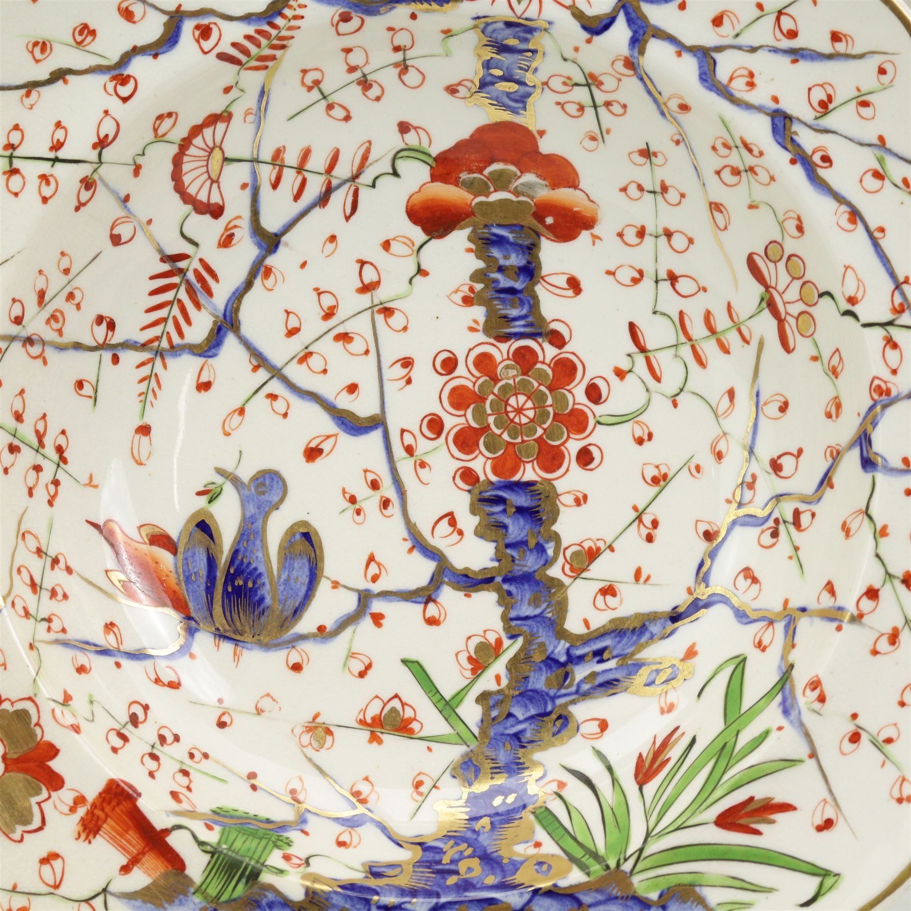 Set of four early 19th century Derby porcelain bowls decorated in the 'Tree of Life' pattern, in the imari palette, within shaped gilt borders, D26cm (4)