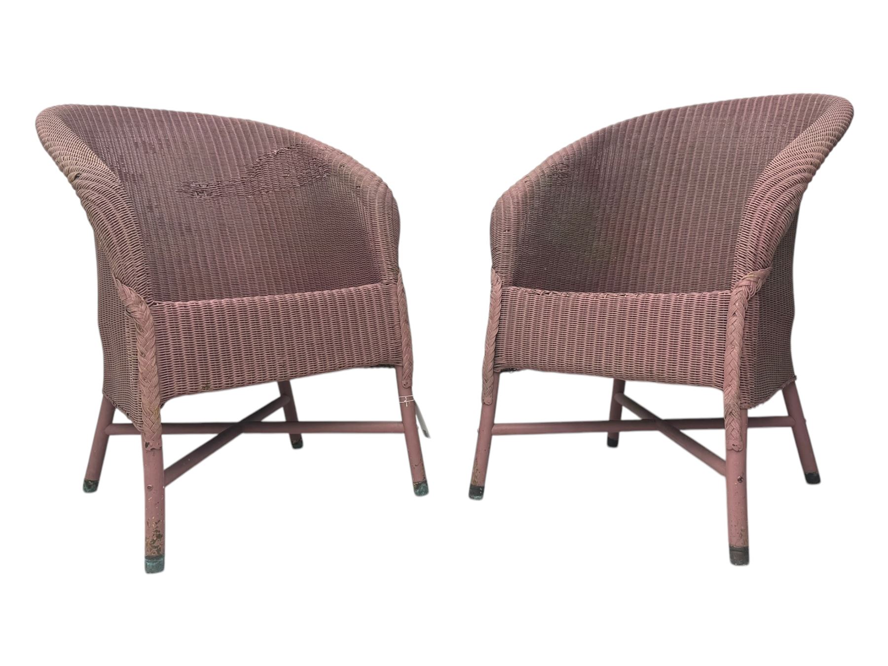 Pair of Lloyd Loom design tub chairs, each with woven wicker construction, curved backrests and painted in a soft pink finish, on cylindrical supports with X-stretchers