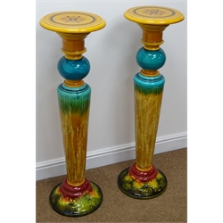  Pair Victorian turquoise and amber glazed jardiniere stands of tapered form with circular top and acanthus leaf moulded base, H103cm  